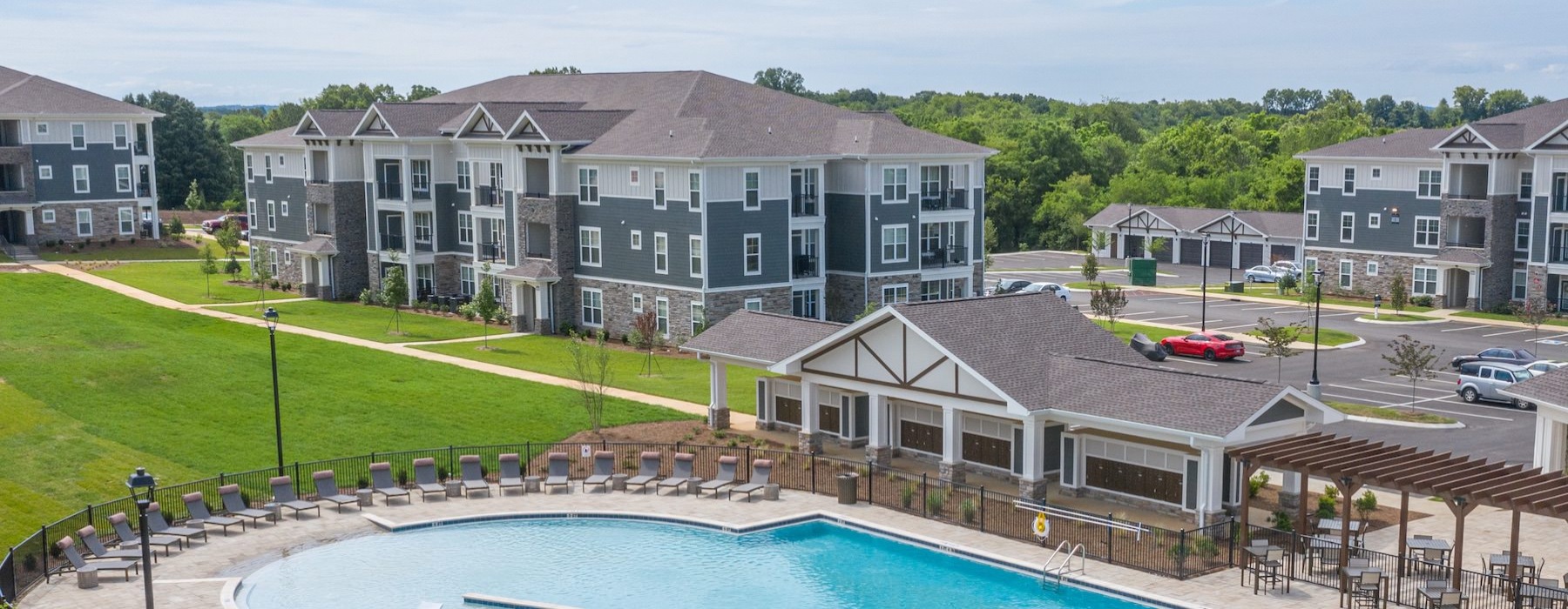 Resort-style swimming pool with lounge seating