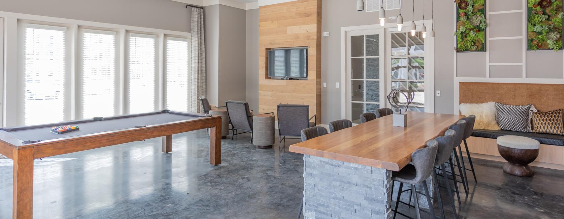 a large room with a table and chairs