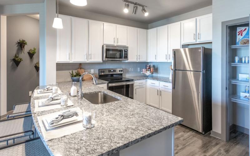a kitchen with white cabinets